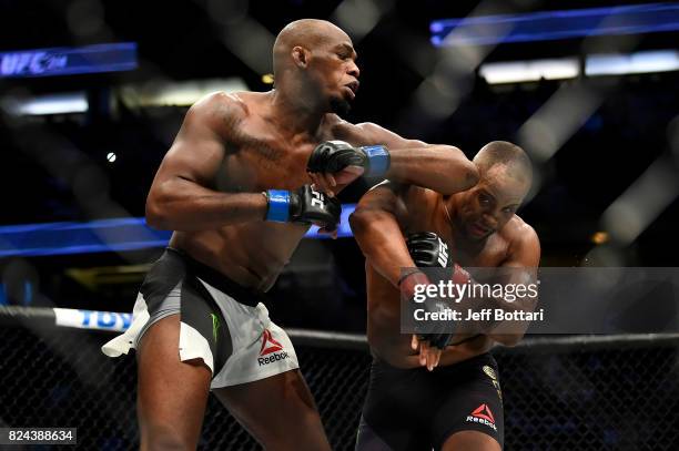 Jon Jones elbows Daniel Cormier in their UFC light heavyweight championship bout during the UFC 214 event inside the Honda Center on July 29, 2017 in...