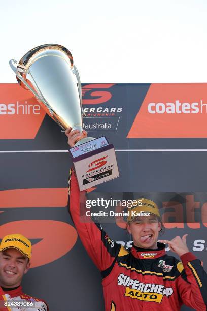 Chaz Mostert driver of the Supercheap Auto Racing Ford Falcon FGX celebrates after winning during race 16 for the Ipswich SuperSprint, which is part...