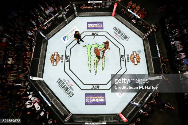An overhead view of the Octagon as Jon Jones punches Daniel Cormier in their light heavyweight championship bout during the UFC 214 event at Honda...