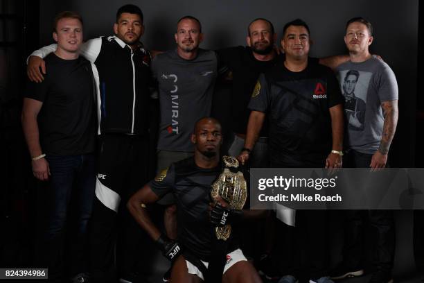 Jon Jones poses for a portrait backstage with his team after his victory over Daniel Cormier during the UFC 214 event at Honda Center on July 29,...