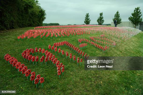 Poppies with personalised messages from members of the British public spell out "1917-2017" at the Tyne Cot Cemetery on July 29, 2017 in Zonnebeke,...