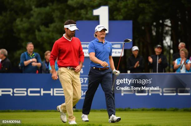 Eduardo De La Riva of Spain and Pontus Widegren of Sweden walk off the 1st tee after playing their first shots during the Porsche European Open - Day...