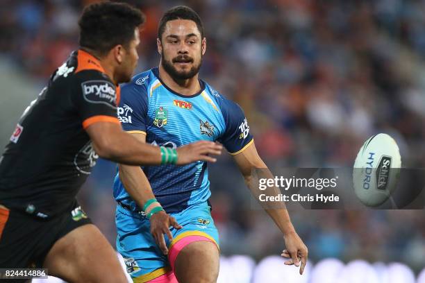 Jarryd Hayne of the Titans passes during the round 21 NRL match between the Gold Coast Titans and the Wests Tigers at Cbus Super Stadium on July 30,...