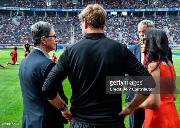 Liverpool's German manager Jurgen Klopp , US businessman and co-owner of Liverpool FC John Henry , and his wife Linda Pizzuti Henry , managing...