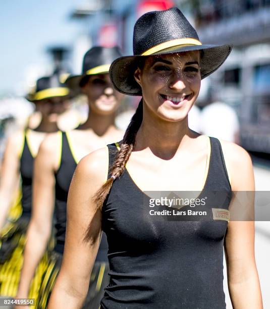 Grid girls walk in the paddock before the Formula One Grand Prix of Hungary at Hungaroring on July 30, 2017 in Budapest, Hungary.