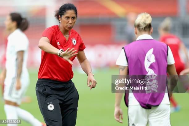 Steffi Jones, head coach of Germany speaks to Isabel Kerschowski of Germany prior to the UEFA Women's Euro 2017 Quarter Final match between Germany...