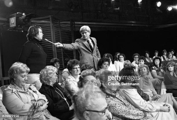 Each day some 200 women are seated on metal chairs in the Donahue studio to see and participate in the show. There is a live telephone on the set and...