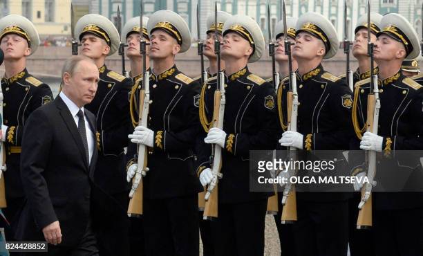 Russian President Vladimir Putin attends a ceremony for Russia's Navy Day in Saint Petersburg on July 30, 2017. President Vladimir Putin oversaw a...