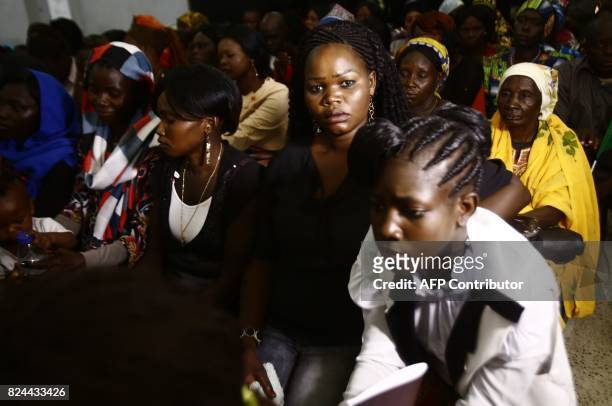 Sudanese Christians attend a ceremony led by the Archbishop of Canterbury at Khartoum's All Saints Cathedral on July 30, 2017. Archbishop of...