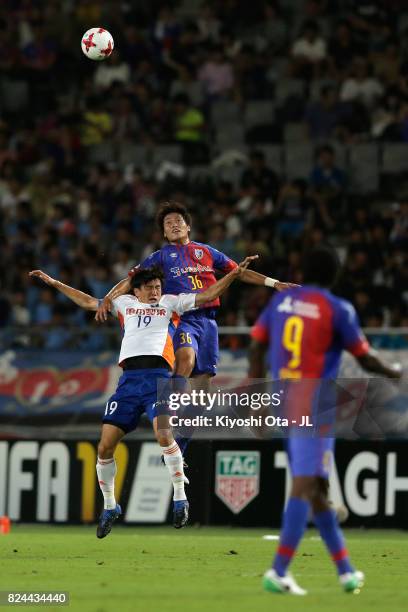 Masayuki Yamada of FC Tokyo and Kisho Yano of Albirex Niigata compete for the ball during the J.League J1 match between FC Tokyo and Albirex Niigata...