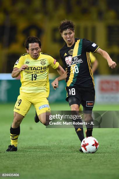 Hirotaka Mita of Vegalta Sendai controls the ball under pressure of Hiroto Nakagawa of Kashiwa Reysol during the J.League J1 match between Vegalta...