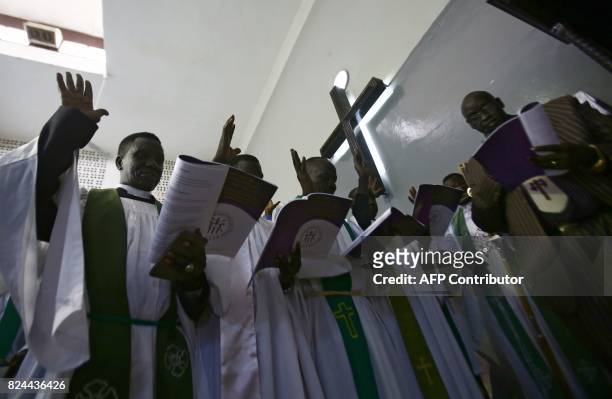 Sudanese Christians take part in a ceremony led by the Archbishop of Canterbury at Khartoum's All Saints Cathedral on July 30, 2017. Archbishop of...
