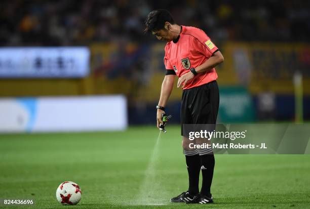 Referee Yuichi Nishimura uses vanishing sprey during the J.League J1 match between Vegalta Sendai and Kashiwa Reysol at Yurtec Stadium Sendai on July...