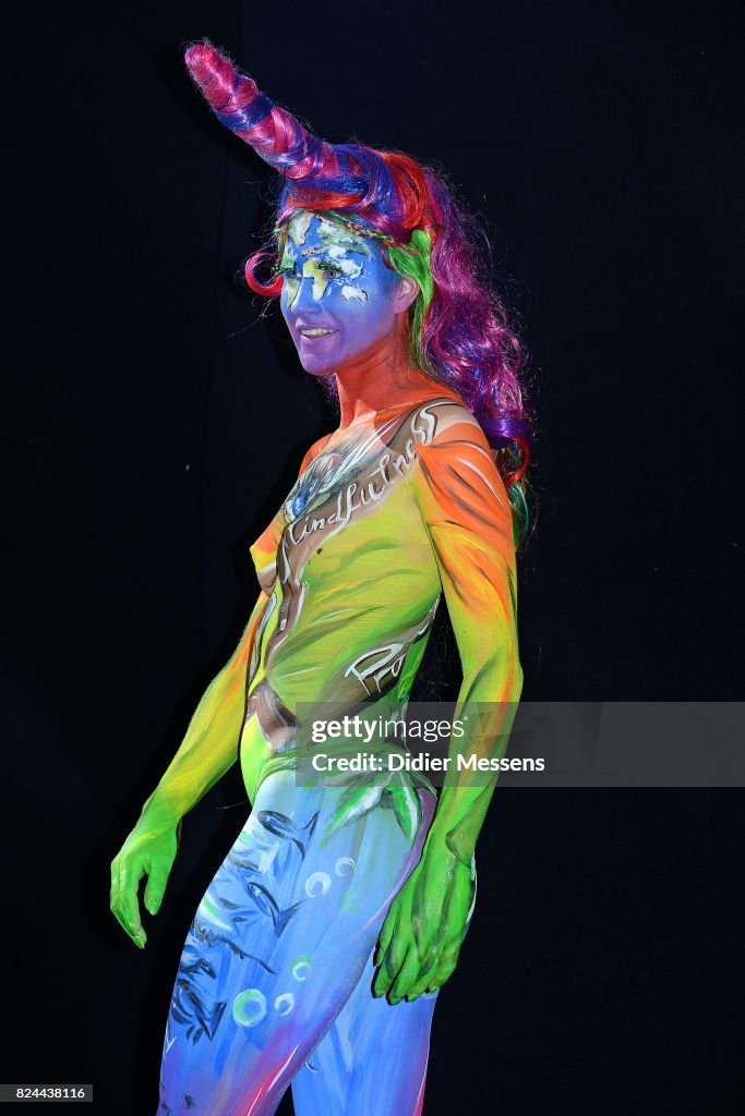 A model poses with her bodypainting designed by bodypainting artist ...