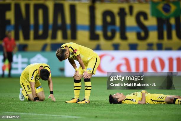 Kosuke Taketomi, Ryuta Koike and Naoki Wako of Kashiwa Reysol show dejection after the J.League J1 match between Vegalta Sendai and Kashiwa Reysol at...