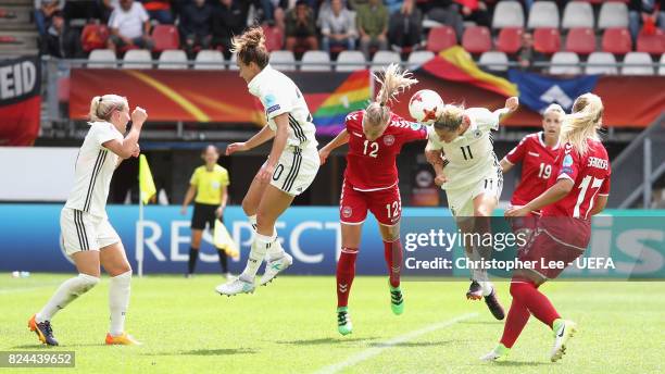 Stine Larsen of Denmark and Anja Mittag of Germany battle to win a header during the UEFA Women's Euro 2017 Quarter Final match between Germany and...