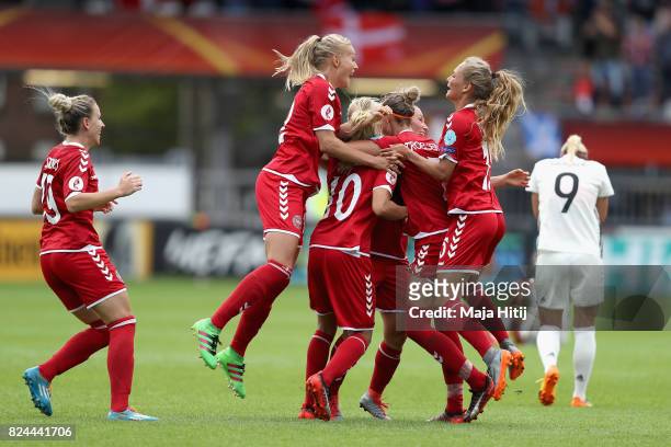 The Denmark team celebrate victory after the UEFA Women's Euro 2017 Quarter Final match between Germany and Denmark at Sparta Stadion on July 30,...