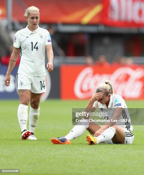 Mandy Islacker of Germany and Anna Blasse of Germany are dejected after the UEFA Women's Euro 2017 Quarter Final match between Germany and Denmark at...