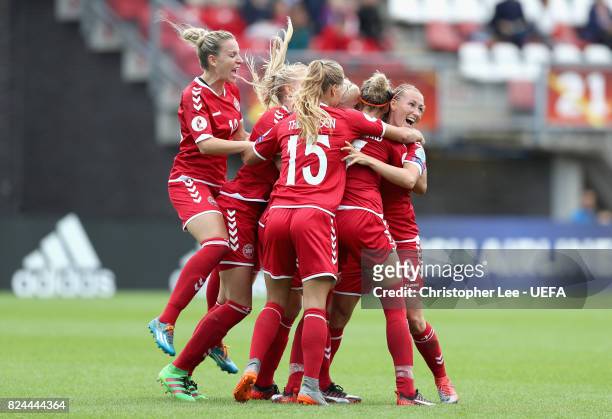 The Denmark team celebrate victory after the UEFA Women's Euro 2017 Quarter Final match between Germany and Denmark at Sparta Stadion on July 30,...