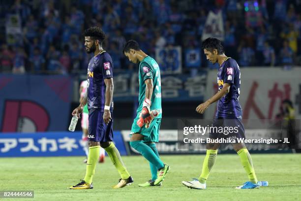 Patric, Hirotsugu Nakabayashi and Kosei Shibasaki of Sanfrecce Hiroshima show dejection after their 0-1 defeat in the J.League J1 match between...