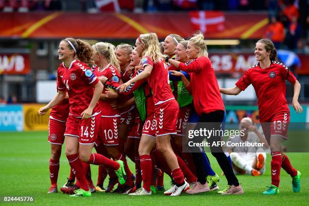 Denmark's players react after winning the quarter-final UEFA Women's Euro 2017 football match against Germany at Stadium Sparta Rotterdam in...