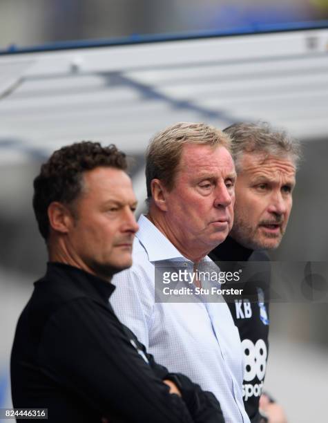 Birmingham manager Harry Redknapp flanked by assistant Manager Kevin Bond and coach Paul Groves look on during the Pre Season Friendly match between...