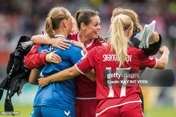 Denmarks' defender Simone Boye Sorensen celebrates with teammates after Denmark defeated Germany in the quarter final match of the UEFA Women's Euro...