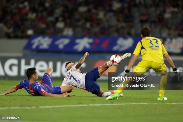 Rony of Albirex Niigata controls the ball under pressure of Akihiro Hayashi and Yuhei Tokunaga of FC Tokyo during the J.League J1 match between FC...