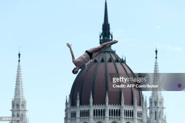 Andy Jones competes in round 3 of the men's High Diving competition at the 2017 FINA World Championships in Budapest, on July 30, 2017. / AFP PHOTO /...