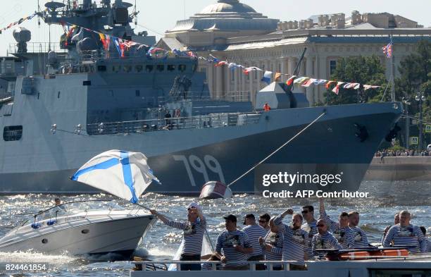 Russian Navy veterans celebrate Russia's Navy Day in Saint Petersburg on July 30, 2017. President Vladimir Putin oversaw a pomp-filled display of...