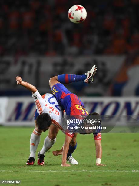 Masayuki Yamada of FC Tokyo and Atsushi Kawata of Albirex Niigata compete for the ball during the J.League J1 match between FC Tokyo and Albirex...