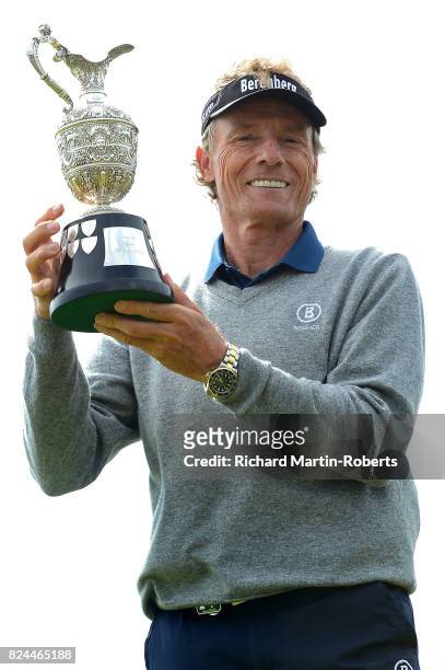 Bernhard Langer of Germany holds aloft the Senior Claret Jug following his victory during the final round of the Senior Open Championship presented...