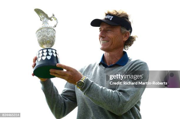 Bernhard Langer of Germany holds the Senior Claret Jug following his victory during the final round of the Senior Open Championship presented by...