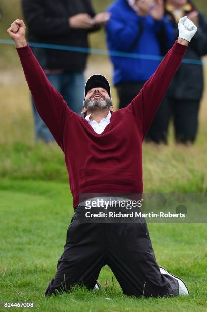 Santiago Luna of Spain celebrates chipping in on the 18th green during the final round of the Senior Open Championship presented by Rolex at Royal...