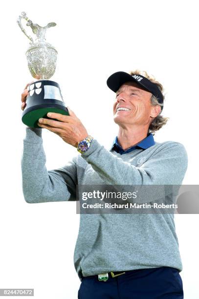 Bernhard Langer of Germany holds the Senior Claret Jug aloft following his victory during the final round of the Senior Open Championship presented...