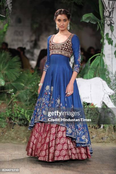 Model walks on the ramp showing creations made by designer Anju Modi during the day 4 of India Couture Week 2017, organised by Fashion Design Council...