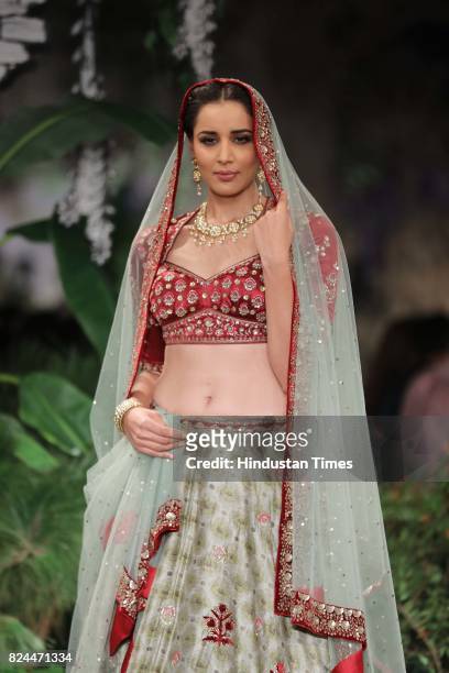 Model walks on the ramp showing creations made by designer Anju Modi during the day 4 of India Couture Week 2017, organised by Fashion Design Council...
