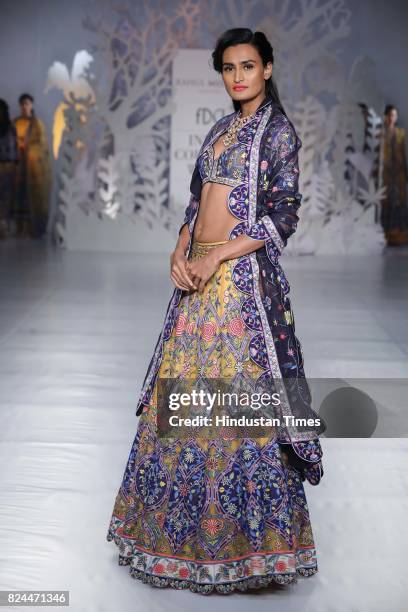 Model walks on the ramp showing creations made by designer Rahul Mishra during the day 4 of India Couture Week 2017, organised by Fashion Design...