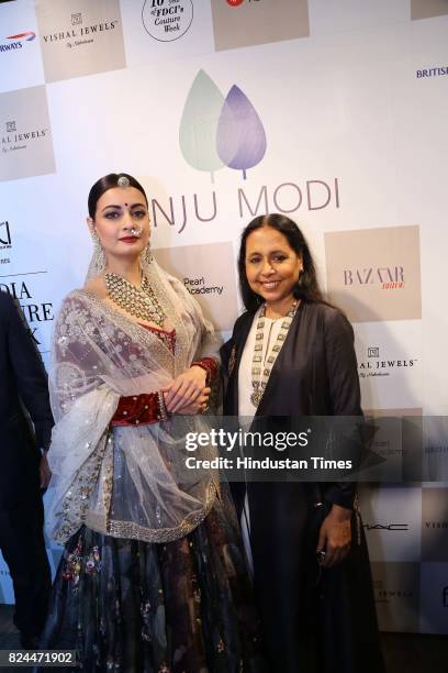 Bollywood actor Dia Mirza with designer Anju Modi during the day 4 of India Couture Week 2017, organised by Fashion Design Council of India, with...