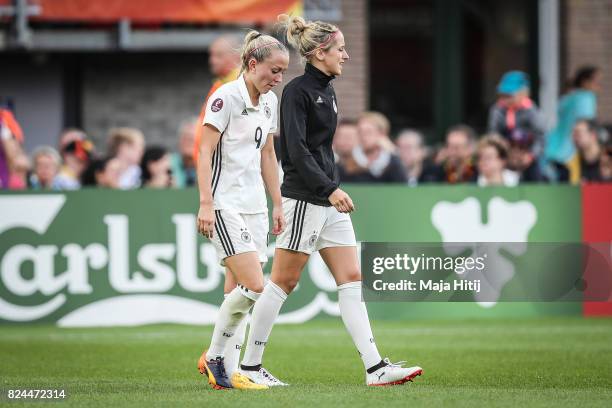 Mandy Islacker and Kathrin Hendrich of Germany react after the UEFA Women's Euro 2017 Quarter Final match between Germany and Denmark at Sparta...
