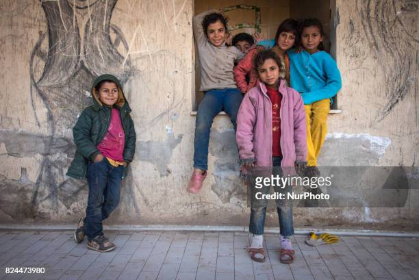 Syrian refugees living and working in seasonal agricultural camps near Izmir, Turkey. Refugees are often exploited and underpaid in Turkey's...