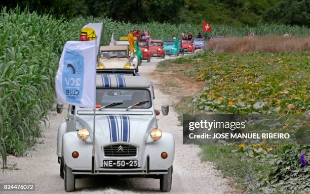 Cars parade through the country side between Ericeira and Mafra during the World 2017 2CV Meeting July 30, 2017. - The event is held between the 26th...