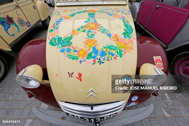 Car with a handicrafted painting is pictured in the parking area in Mafra after the parade of the World 2017 2CV Meeting July 30, 2017. - The event...