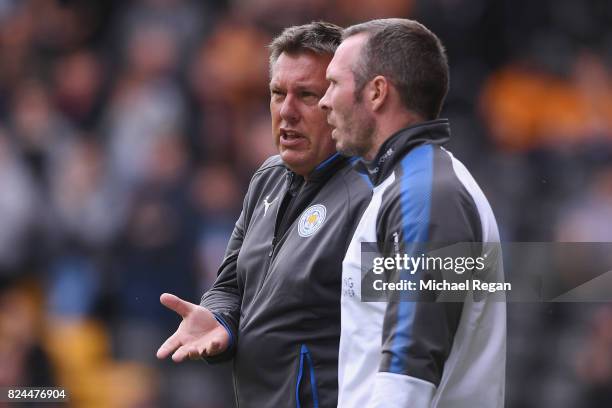 Leicester manager Craig Shakespeare speaks to assistant manager Michael Appleton during the pre-season friendly match between Wolverhampton Wanderers...