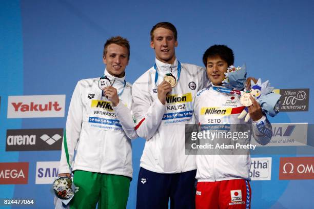 Silver medalist David Verraszto of Hungary gold medalist Chase Kalisz of the United States and bronze medalist Daiya Seto of Japan pose with the...