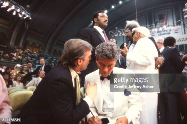 Businessman Donald Trump and Ring Announcer Michael Buffer with Reverend Jesse Jackson Actor Redd Foxx and Promoter Don King in background at Tyson...