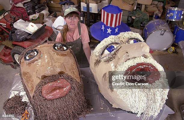 Glenda Breeden of rural Spencer, IN displays the heads of the 14 ft. Tall puppets May 6, 2001 in her workshop barn in Spencer, IN that are being made...