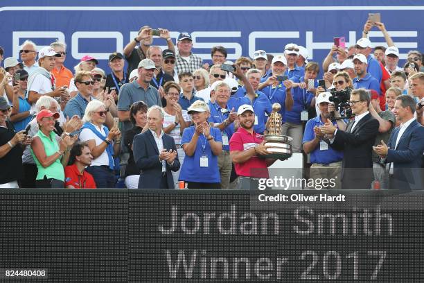 Jordan Smith of England celebrate with the trophy after the final round during the Green Eagle Golf Course on July 30, 2017 in Hamburg, Germany.
