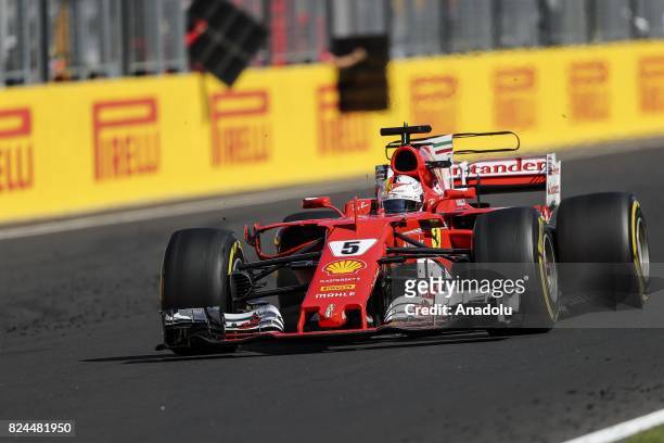 Race winner Sebastian Vettel of Germany and Ferrari drives his car during the Formula One Grand Prix of Hungary at Hungaroring on July 30, 2017 in...