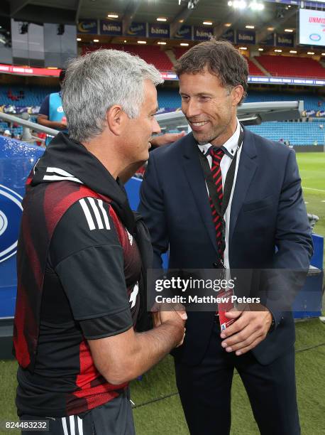 Manchester United Manager / Head Coach Jose Mourinho shakes hands with ex-United player Ronny Johnsen prior to the pre-season friendly match between...